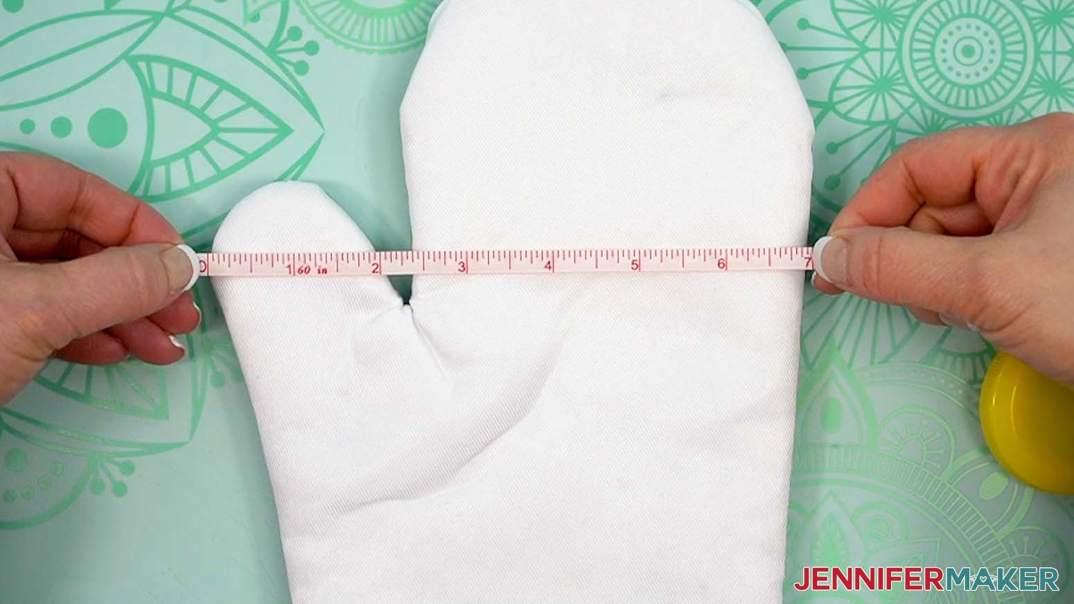 Measure the dimensions of the oven mitt to verify the design will cover the surface.