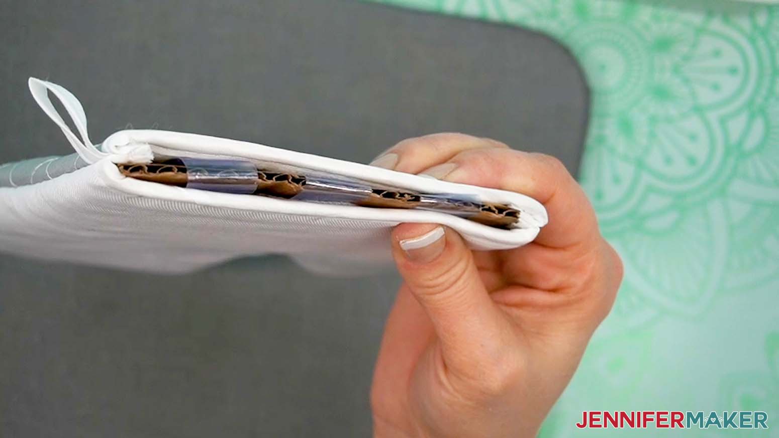 Use tape to help hold the oven mitt tight over the insert.