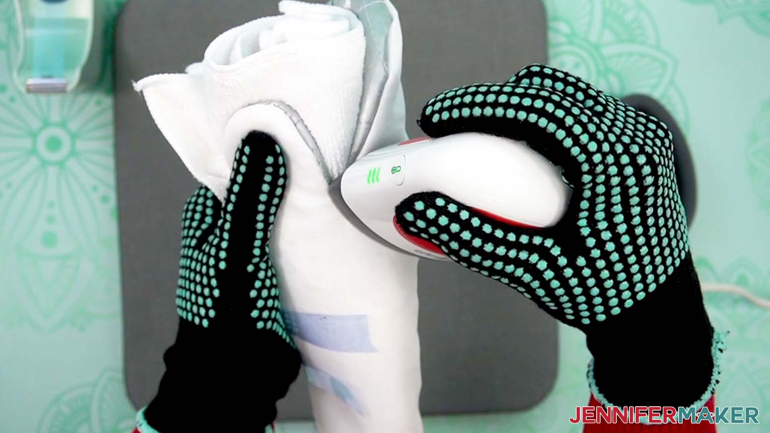 Press the mini press into the thumb area of the sublimation oven mitt to smooth the wrinkles.