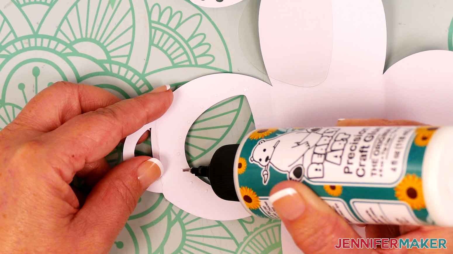Apply small dots of craft glue around the window opening.