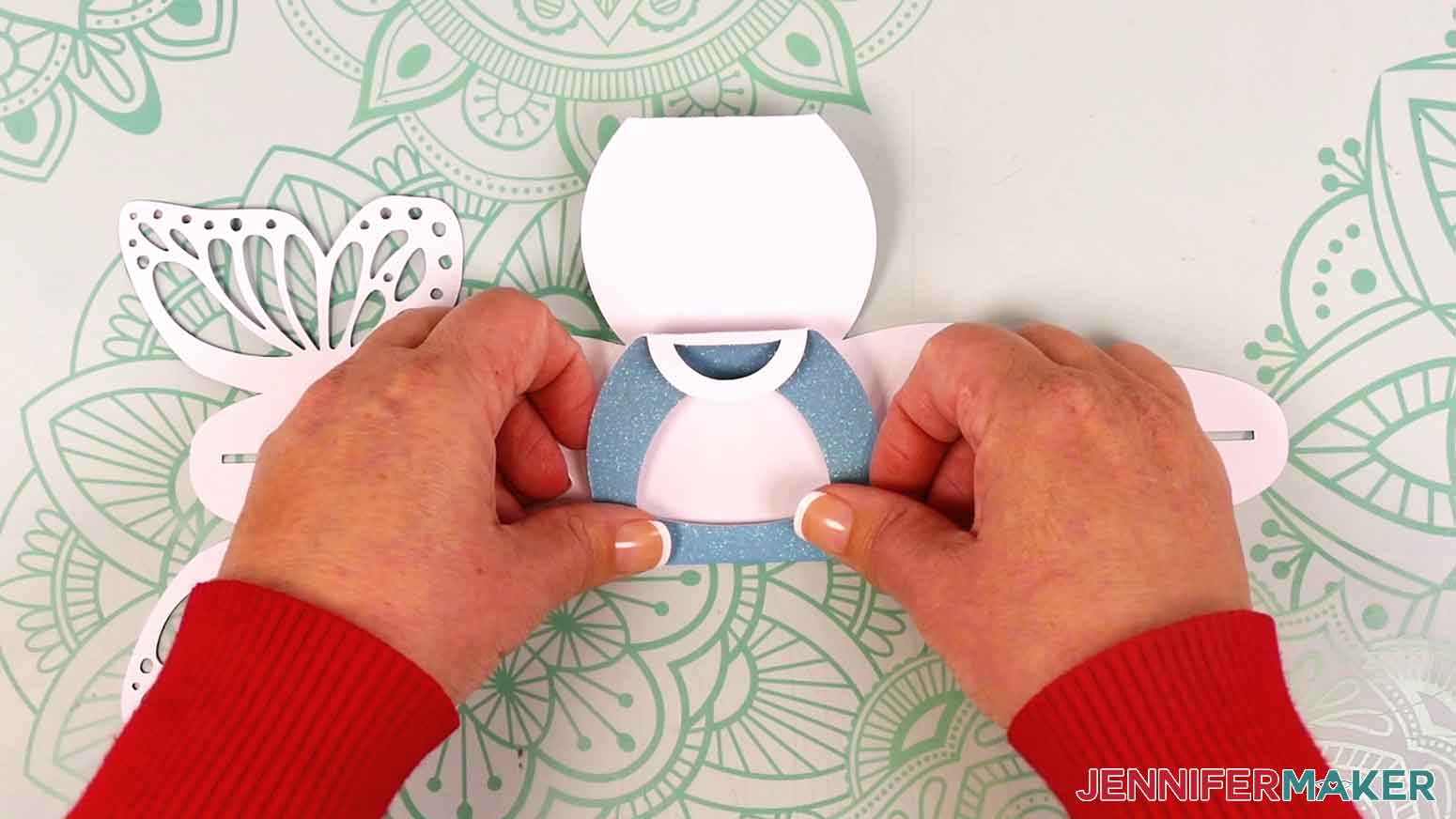 Fold up the sides of the treat box along the crease lines with the glitter side facing outward.