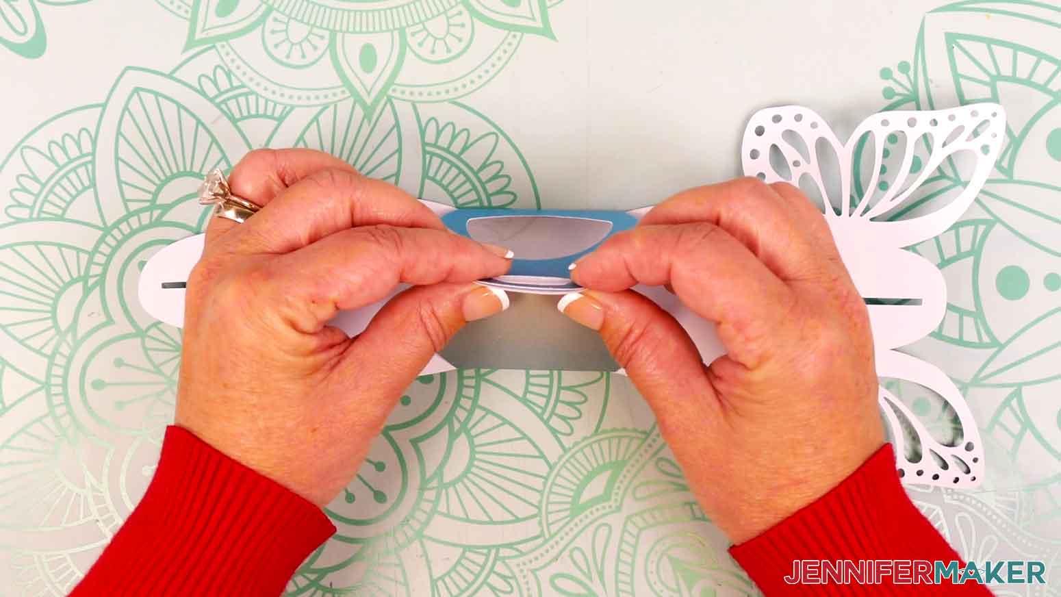 Fold up the front and back panels of the treat box and pinch the handles together.