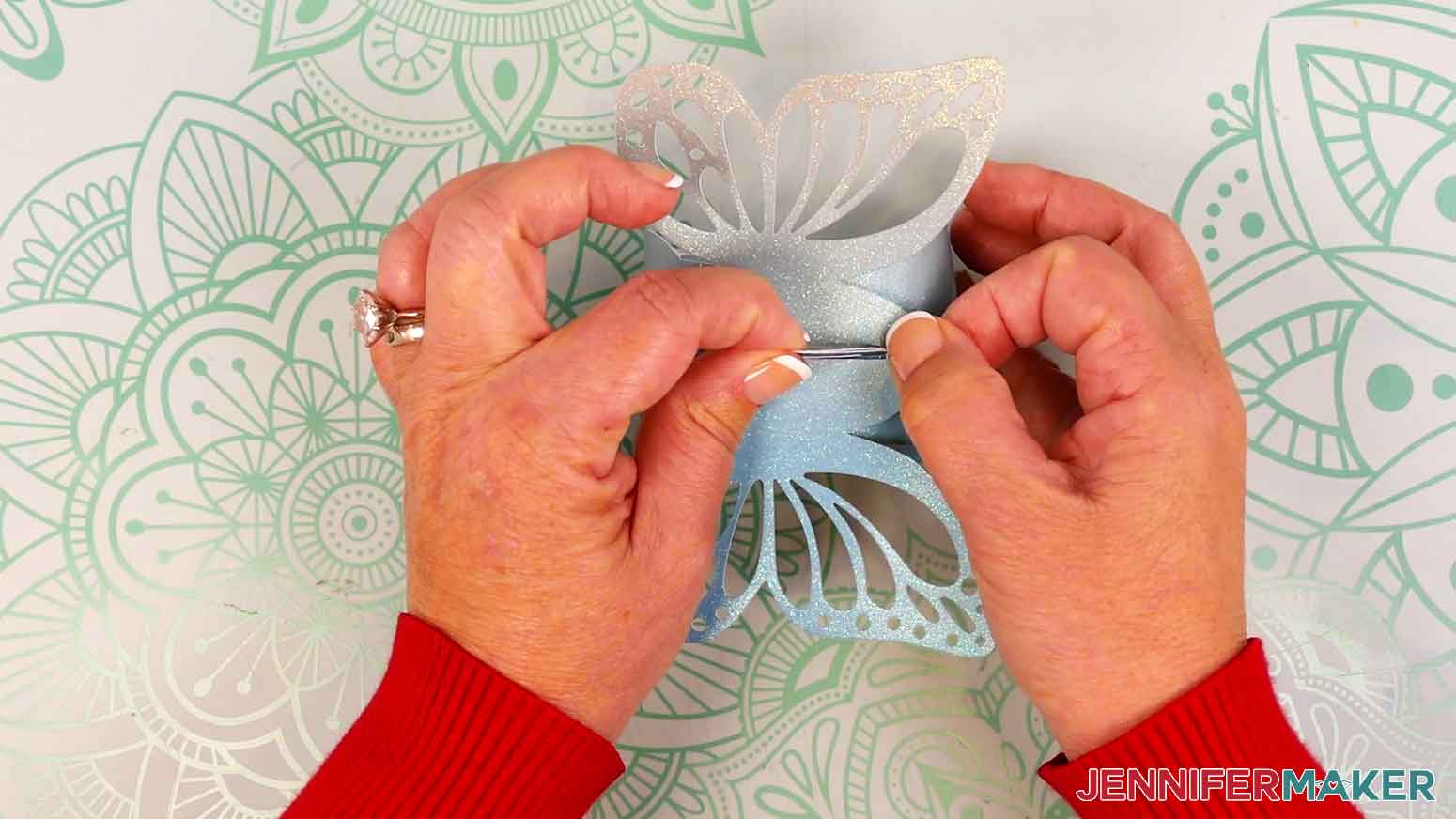 Place the butterfly side over the handles and press into place.