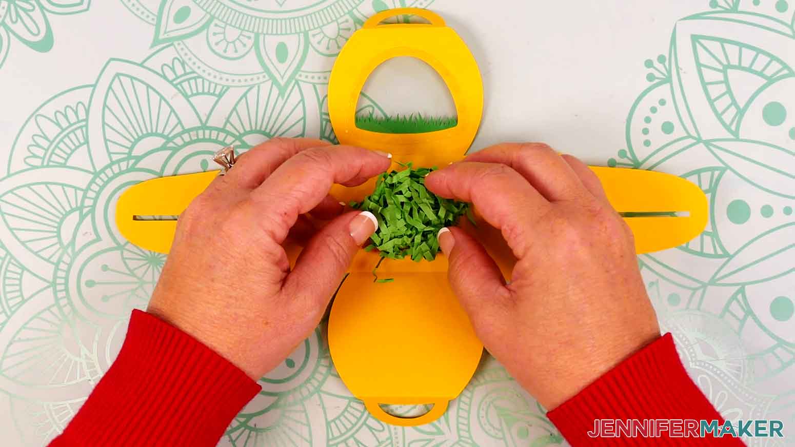Place a small amount of paper crinkle grass in the center of the treat box.