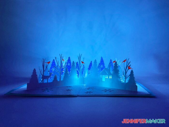 Winter pop-up card with trees and cardinals, light up in blue LED light