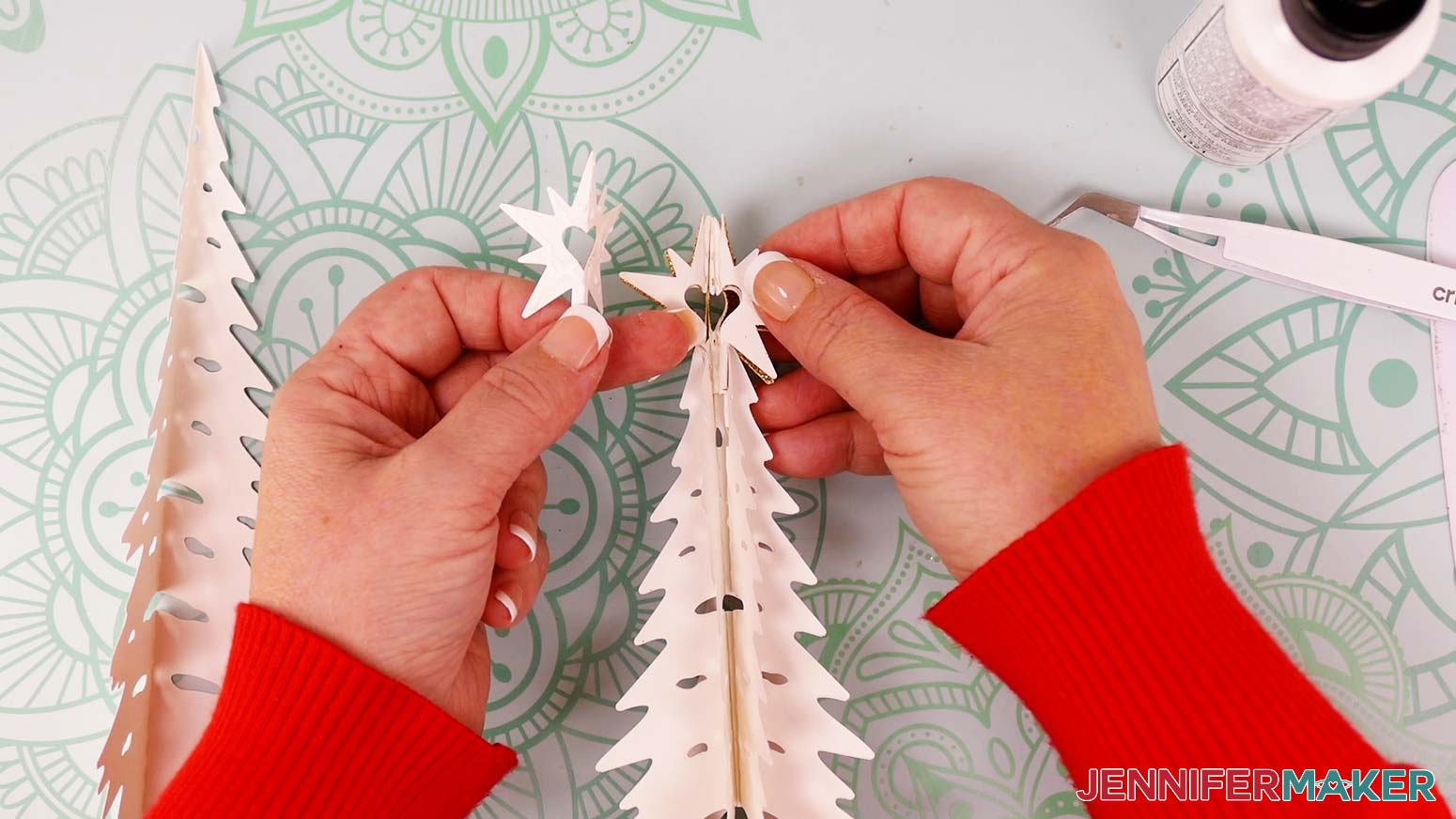 When you get to the last star piece, glue both halves onto their corresponding star backs attached to the tree