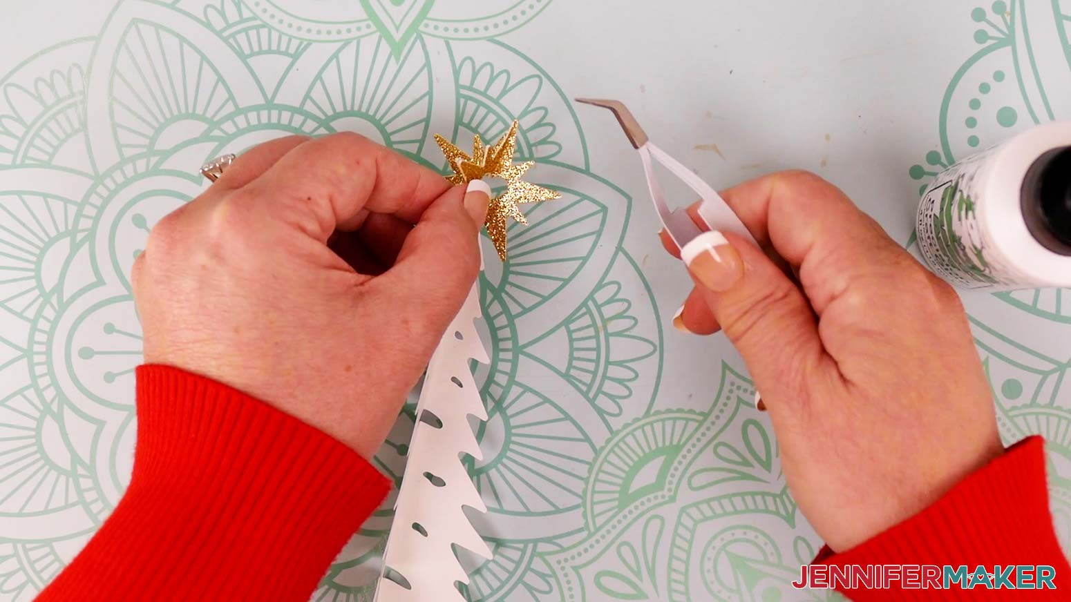 Attach the glued section to the back of one half of the first star piece, aligning the halves as close as possible at their edges.