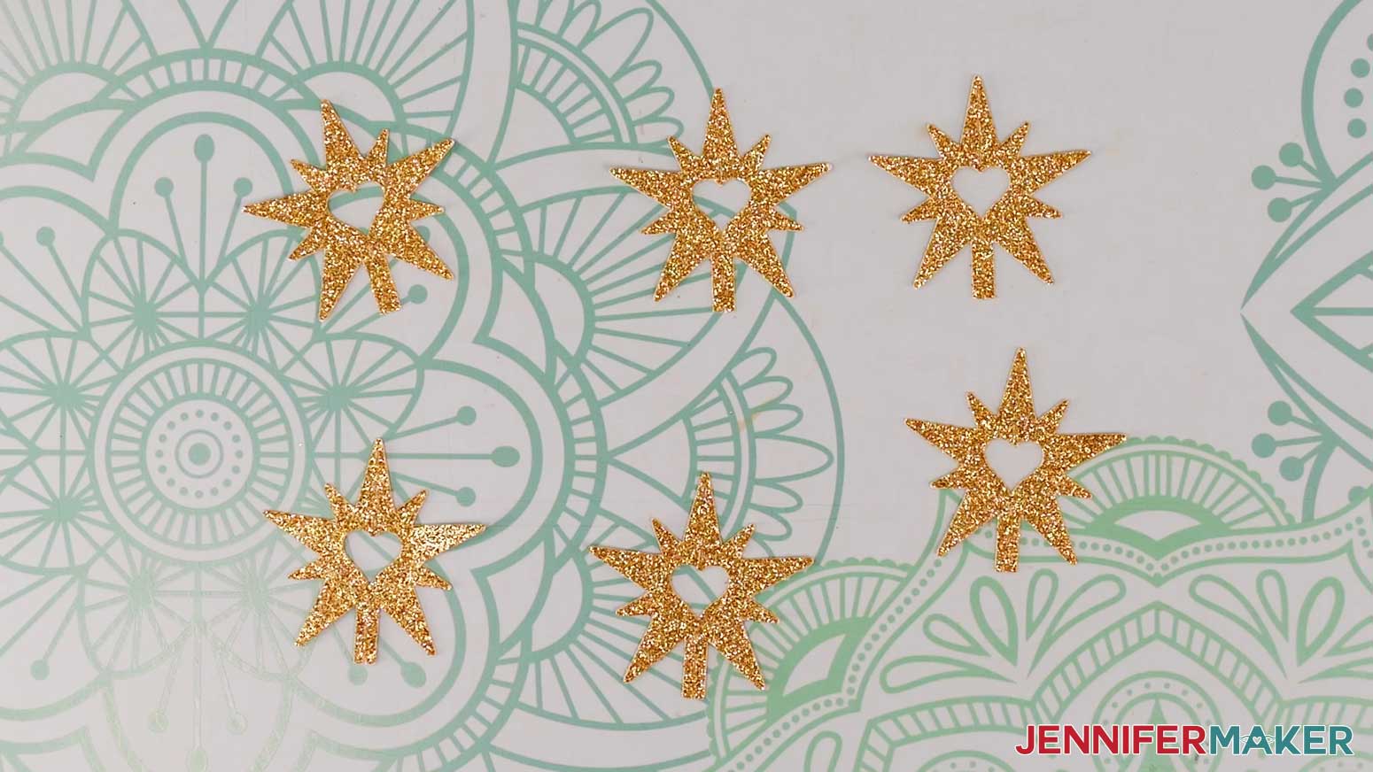 Six star pieces cut out of glitter cardstock