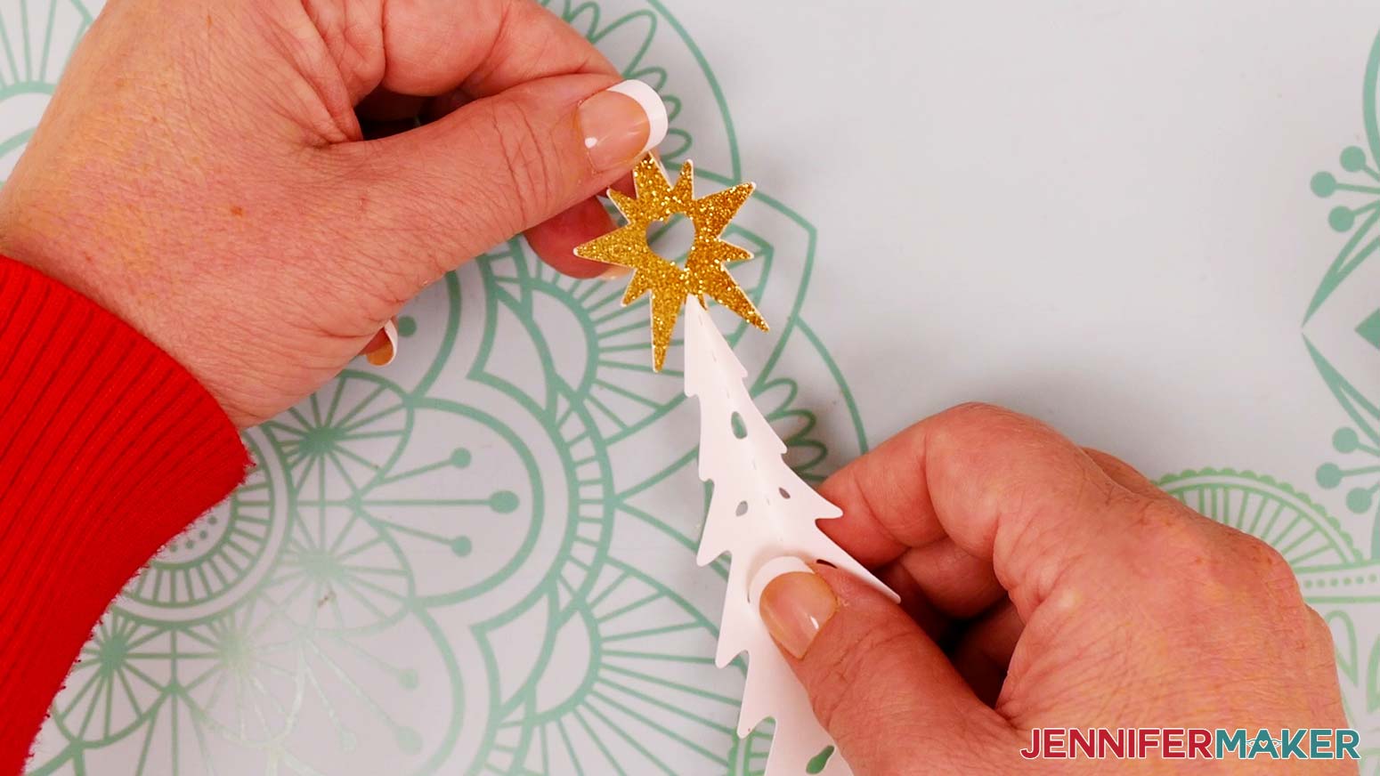 Make sure the folds are aligned and the glitter side of the star is face out.