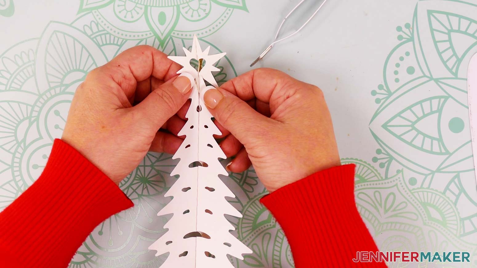 The base of your first star piece should now be sandwiched between the two tree halves.