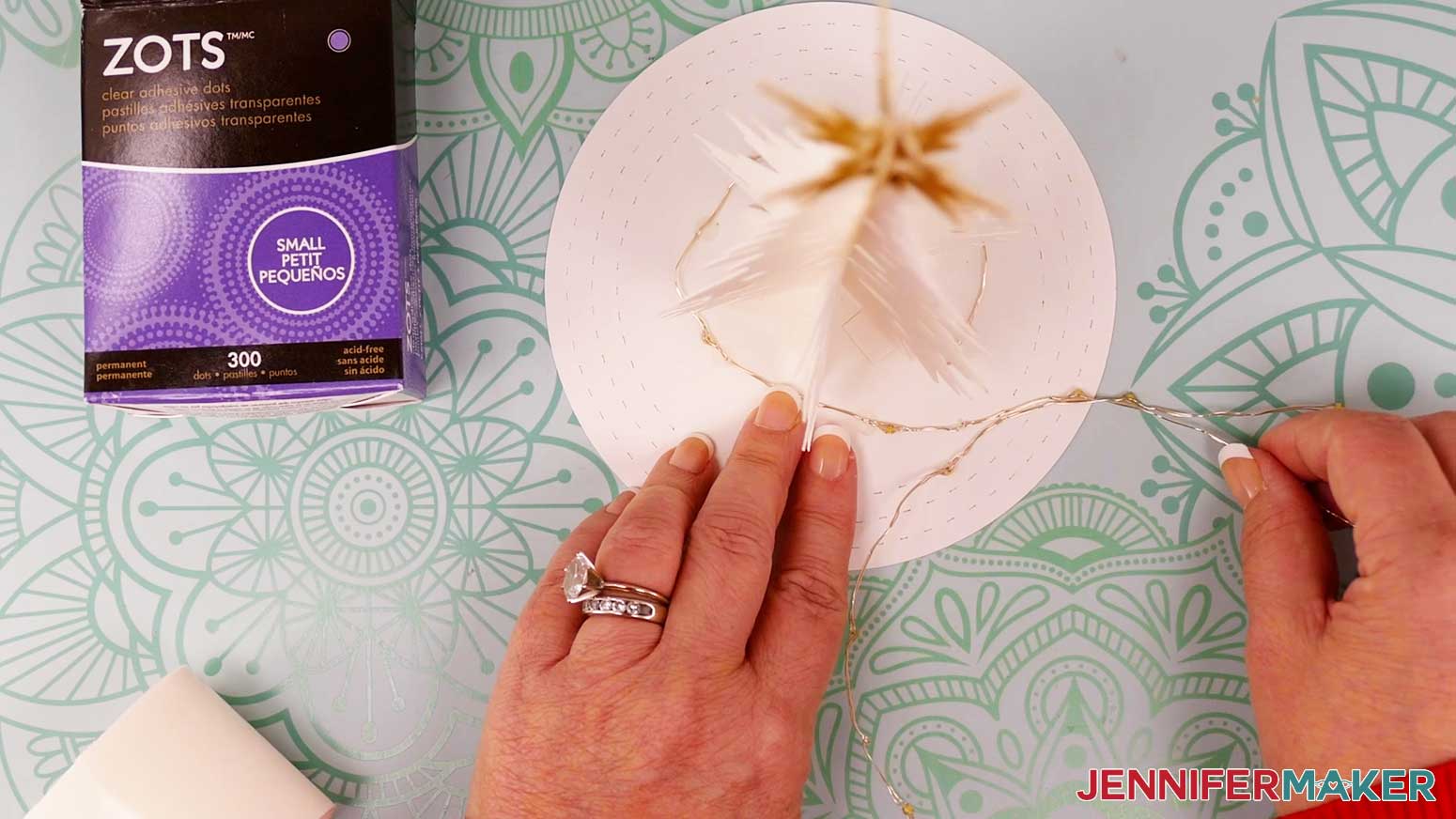 Use small glue dots every few inches to secure the lights