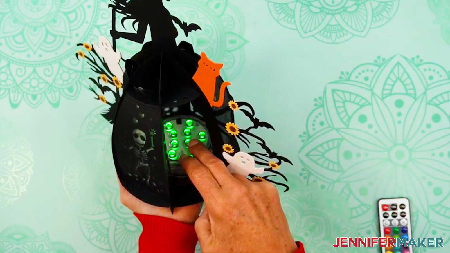 Place the LED puck light in the bottom of the witch lantern base.