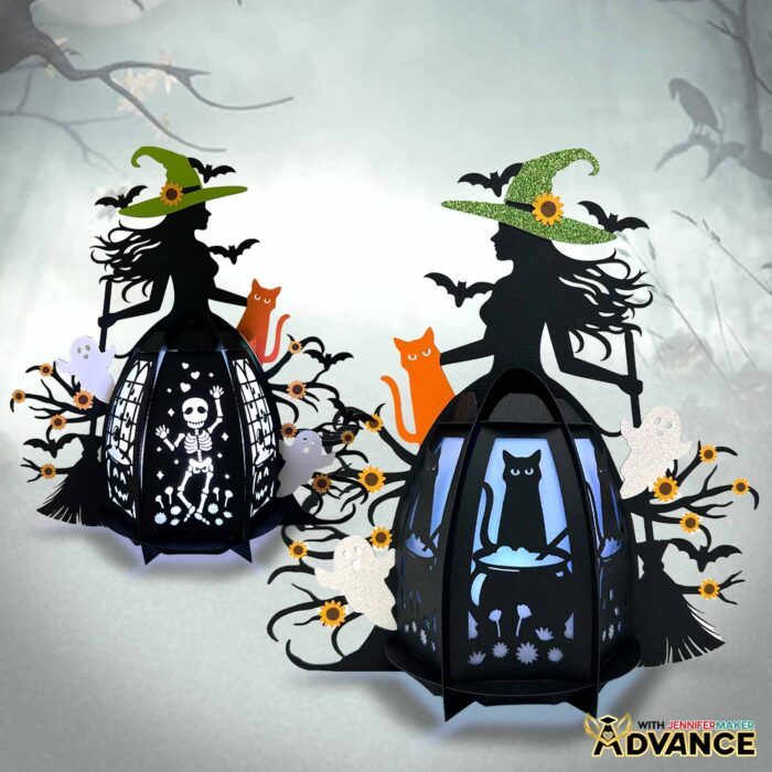 Two enchanting Paper Witch Lantern designs illuminated against a spooky forest background, made of black cardstock with colored details