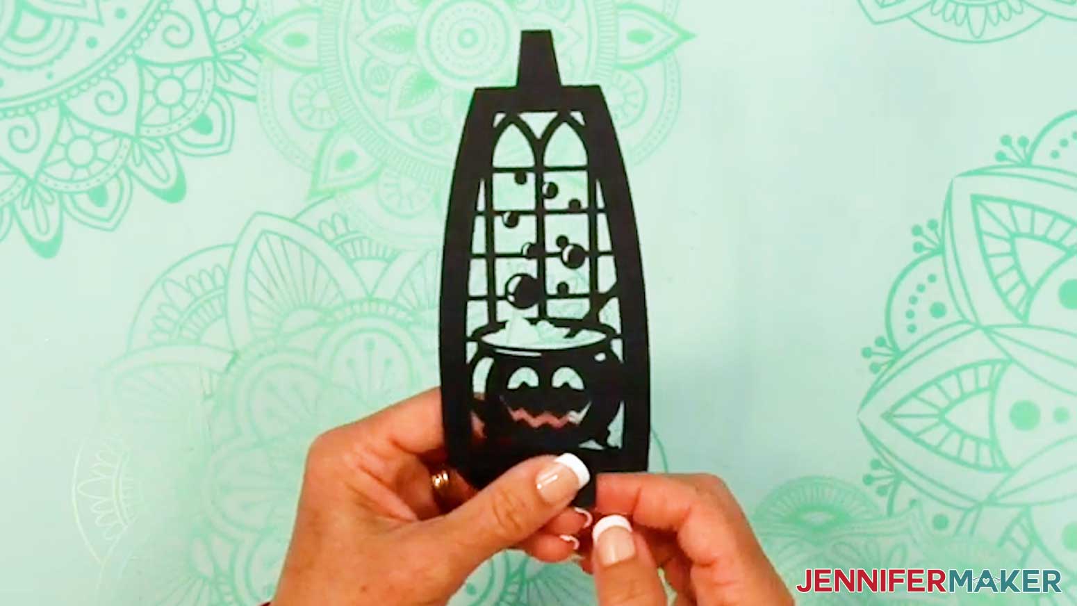 Fold back the witch lantern panel's top tab&rsquo;s two wings along the vertical crease lines, and do the same for the bottom tab wings.