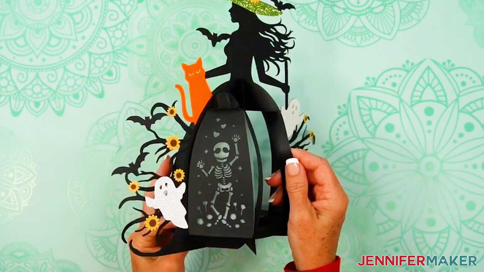 Insert a witch lantern panel&rsquo;s top and bottom tabs into the first section of the frame&rsquo;s top and bottom base slots.