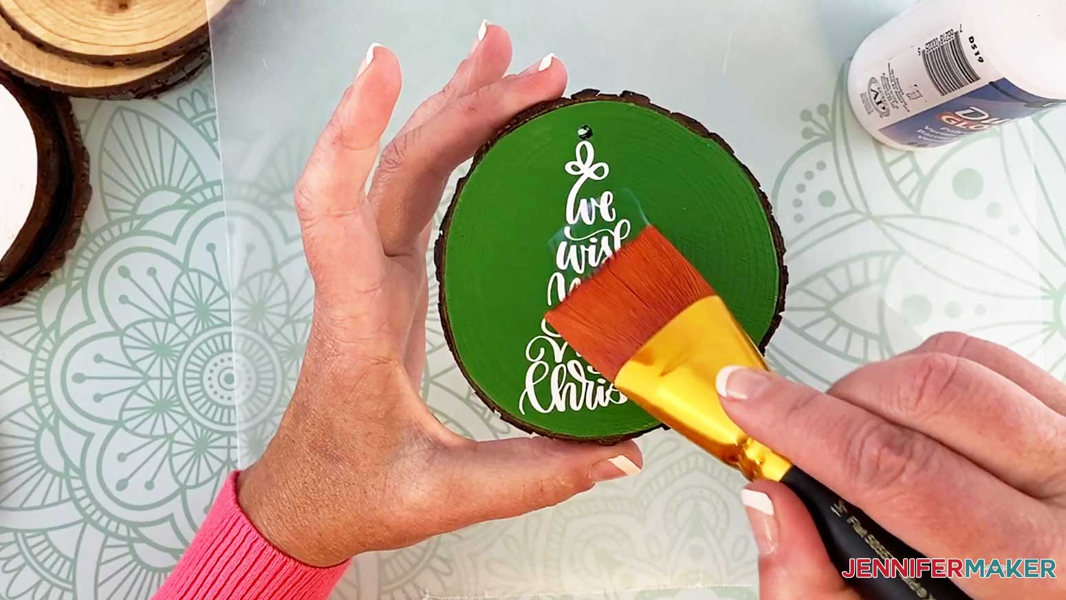 Paint duraclear over the wood slice ornament to protect it