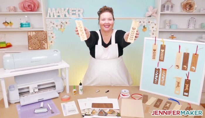 Jennifer Maker with her wooden bookmarks and Cricuts in her craft studio